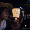 -8월 10일 오후 서울광장에서 열린 ‘국정원 정치 공작 규탄 제6차 범국민촛불대회’에서 참가자가 KTX 민영화에 반대하는 촛불을 들고 있다.