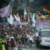 -폭우가 내린 7월 15일 서울광장에서 열린 퀴어문화축제에서 5만여 명이 무지개 깃발을 흔들며 축제를 즐기고 있다.