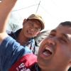 - ‘이주노동자 투쟁 투어버스’  참가자들이  이주노동자들에게 큰 고통을 주고 있는 사업장 앞에서 구호를 외치며 사업장을 규탄하고 있다.   