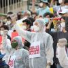 -노동절인 5월 1일 오후 서울 세종문화회관 계단에서 코로나19 비정규직 긴급행동이 집회를 열고 구호를 외치고 있다.